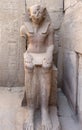 Seated Statue of Pharaoh Thutmose III near the Festival Hall of Thutmose III at The Karnak Temple Complex in Luxor, comprises a Royalty Free Stock Photo