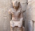 Seated Statue of Pharaoh Thutmose III near the Festival Hall of Thutmose III at The Karnak Temple Complex in Luxor, comprises a Royalty Free Stock Photo