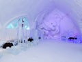Seating area of the spectacular bar of the world-renowned seasonal Ice Hotel illuminated in blue Royalty Free Stock Photo