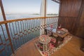 Seating on the balcony of a luxury river cruise boat with cocktails