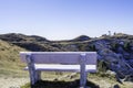 Seating Bench at mountain top of snow and greenary for tourist attraction
