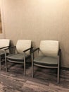 Seating chairs in the moderm interior of a clinic recption room Royalty Free Stock Photo