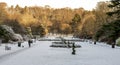 Seaton park central alley with flower beds and plants covered with snow, Aberdeen, Scotland