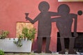 Seats created with two metal figures representing a man and a woman created in Barga in the province of Lucca in Tuscany.