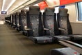 Seats in an empty carriage of an Aeroexpress high-speed train. Airport railway line.