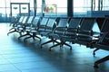 Seats from metal in airport hall Royalty Free Stock Photo