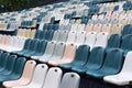 Seats in rows in empty auditorium outdoors after rain