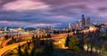 Seattle cityscape at dusk under a dramatic sky