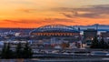 Seattle downtown and Safeco Field beyond the I-5 I-90 freeway interchange at sunset in the fall with yellow foliage in the Royalty Free Stock Photo