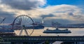 SeattleSeattle waterfront with Great Wheel and the Puget Sound with a ferry boat pulling into Royalty Free Stock Photo
