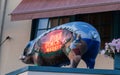 Pike Place Market neon sign on metal pig on veranda outside Royalty Free Stock Photo