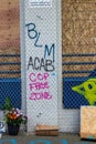 Seattle, WA - 11 June 2020. Black Lives Matter sign held at protest on streets and buildings