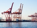 Cargo cranes at the port of Seattle at sunset