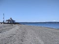 Seattle, WA USA - circa April 2021: Gorgeous view of the Olympic Mountain range on a cloudless day at Discovery Park Royalty Free Stock Photo