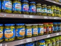 Seattle, WA USA - circa August 2022: Close up, selective focus on jarred pickles for sale inside a QFC grocery store