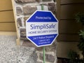 Seattle, WA USA - circa August 2022: Close up view of a SimpliSafe security system sign in front of a house