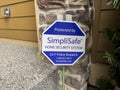 Seattle, WA USA - circa August 2022: Close up view of a SimpliSafe security system sign in front of a house