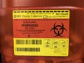 Seattle, WA USA - circa March 2020: Close up view of a red sharps medical waste container inside a medical office