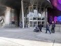 Seattle, WA USA - circa March 2022: Family with a baby stroller entering the Museum of Pop Culture on a bright, sunny day