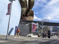 Seattle, WA USA - circa March 2022: Side street view of pedestrian traffic near the Museum of Pop Culture on an overcast day