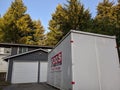 Seattle, WA / USA - circa May 2020: Street view of a PODS Moving and Storage cube sitting in a residential driveway Royalty Free Stock Photo