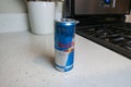 Seattle, WA USA - circa May 2022: View of an opened can of Red Bull on a domestic kitchen counter