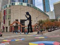 Street view people walking near the colorful Seattle Art Museum on 1st Avenue and