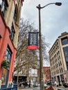 View of a Pioneer Square banner on a lamp post in historic downtown Seattle