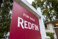 Seattle, WA USA - circa October 2021: Angled view of a Redfin For Sale sign outside a house in a residential neighborhood during Royalty Free Stock Photo