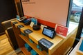 A display of Amazon electronic devices such as, kindle, echo dot, tablet, and echo show at the original U District Amazon