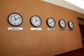 Five clocks depicting the different times at different global time zones Royalty Free Stock Photo