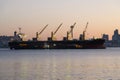 Dawn light on bulk carrier cargo ship HPC Atlantic in Elliott Baty with cranes