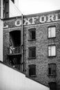 Seattle, Washington-May 18, 2023: Older apartment building with Oxford painted on surface of facade