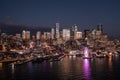 Night time aerial video view  of Seattle Downtown, with the Space Needle, Skyscraper and The Seattle Great Wheel at Waterfront Royalty Free Stock Photo