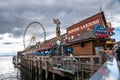 Seattle Washington View from waterfront pier with restaurant and Ferris wheel in view