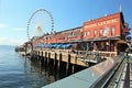 Seattle, Washington, 9/14/17, Seattle waterfront restaurant with a sailboat docked and The Great Wheel in the bachground Royalty Free Stock Photo