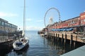 Seattle, Washington, 9/14/17, Seattle waterfront restaurant with a sailboat docked and The Great Wheel in the bachground