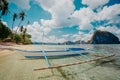 Seaview with traditional fishing boat on the beach under cloudy sky in El Nido. Palawan, Philippines Royalty Free Stock Photo