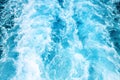 Seawater ship trail with white foam wave. Tropical island marine travel. Cruiseliner seawater trail. Blue ocean top view