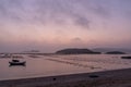 At the seaweed farm before sunrise in the morning, there are seaweed rows and boats Royalty Free Stock Photo