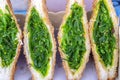 Seaweed salad sandwich for sell at street food market in Thailand, close up. Tasty green seaweed salad sandwich close up Royalty Free Stock Photo