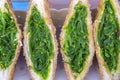 Seaweed salad sandwich for sell at street food market in Thailand, close up. Tasty green seaweed salad sandwich close up Royalty Free Stock Photo