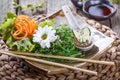 Seaweed Salad wakame in plate with chopsticks on bamboo mat. Japanese Cuisine Royalty Free Stock Photo