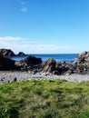 View of the sea and rocks against Royalty Free Stock Photo