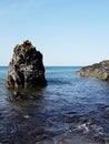 Scenic view of the blue sea and rocks against Royalty Free Stock Photo
