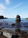 Scenic view of the blue sea and rocks against Royalty Free Stock Photo