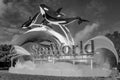 Seaworld sign and whale figures on lightblue cloudy background