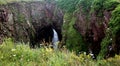 Seaworn Cave in Cliff with Sea Birds Royalty Free Stock Photo