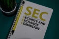 SEC - Security and Exchange Commision acronym write on a book isolated on Office Desk