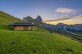 SECEDA, ITALY. 19 SEPTEMBER 2023. Photographer captures sunrise outside a hut at Seceda, Dolomites
